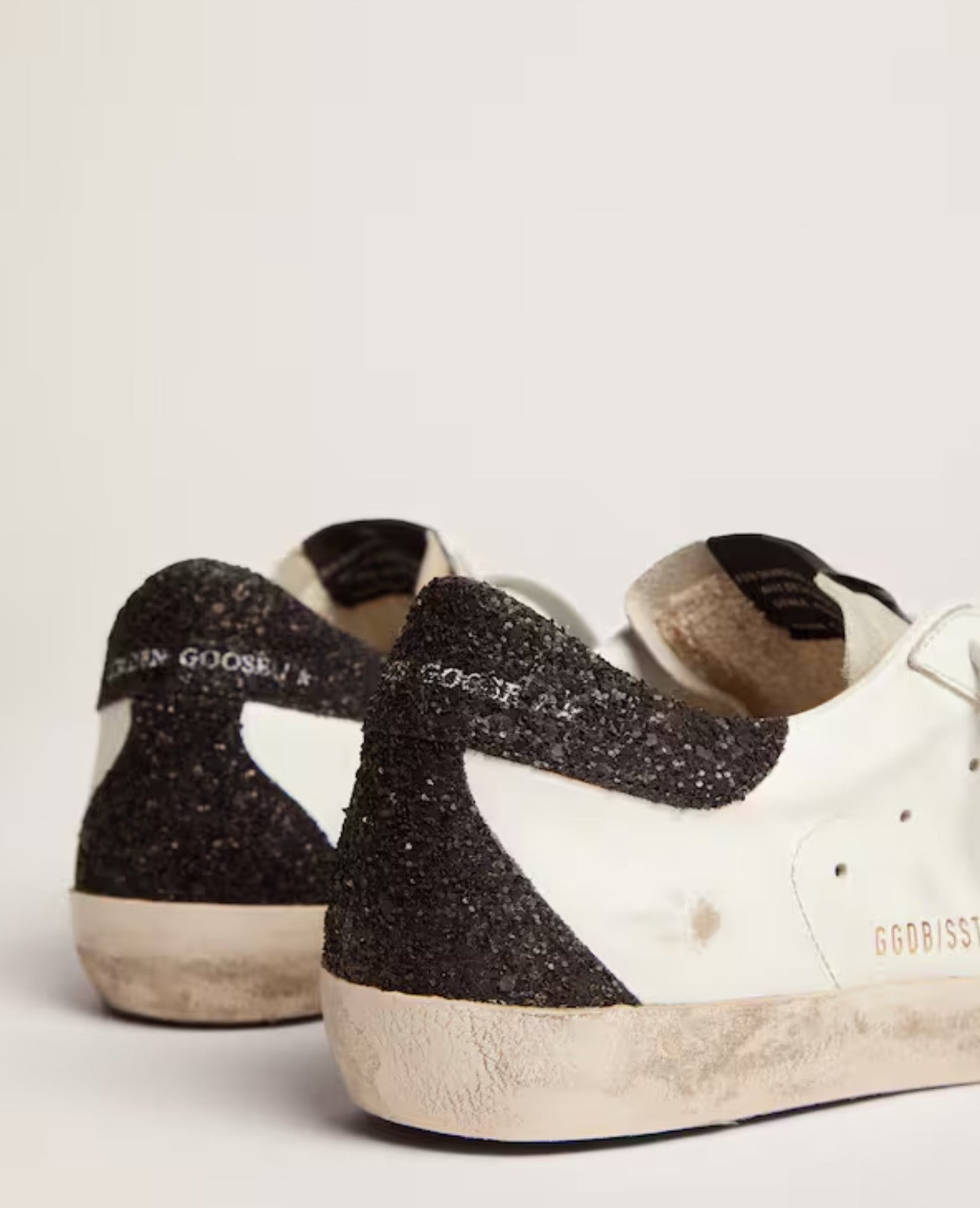 golden goose
women's super-star with gold star and black glitter heel tab_1