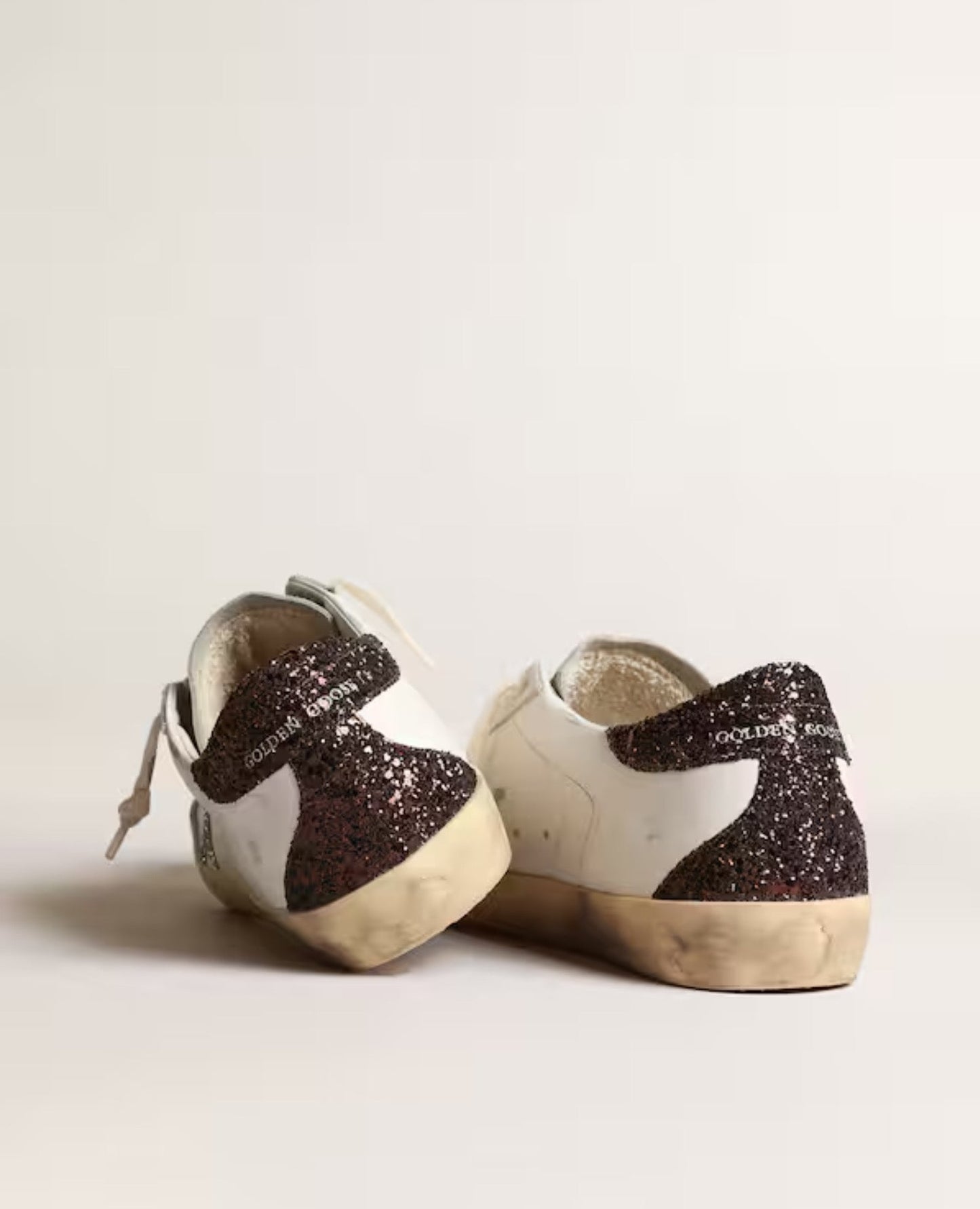 golden goose women's super-star with silver star and brown glitter heel tab_1