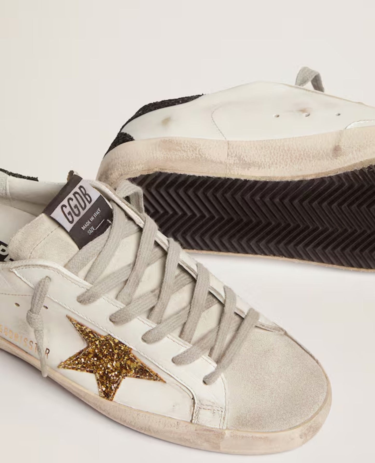 golden goose
women's super-star with gold star and black glitter heel tab_1
