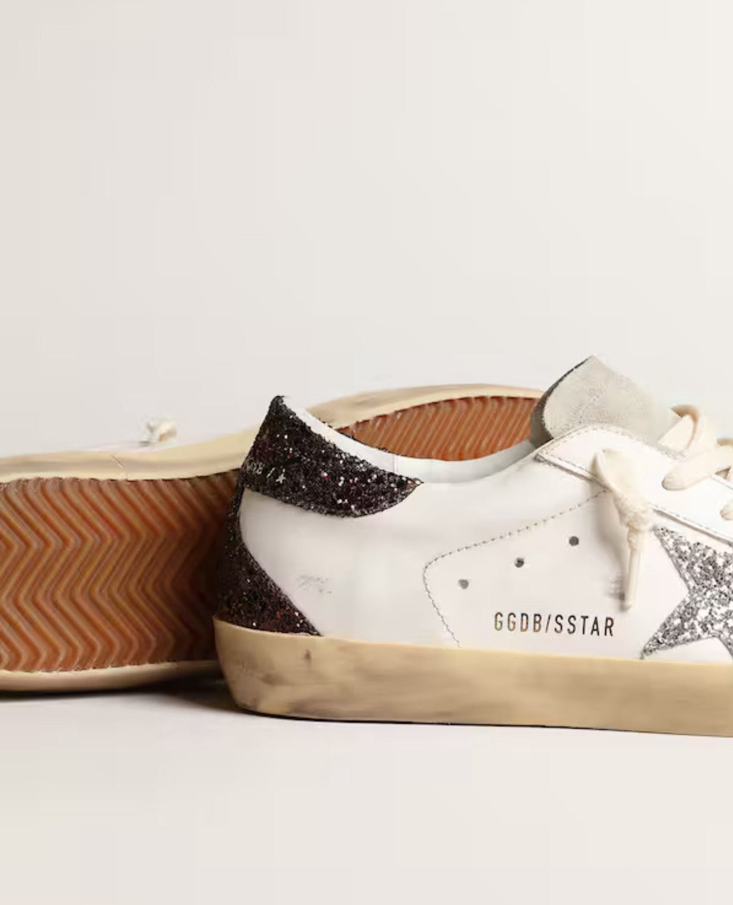 golden goose women's super-star with silver star and brown glitter heel tab_1