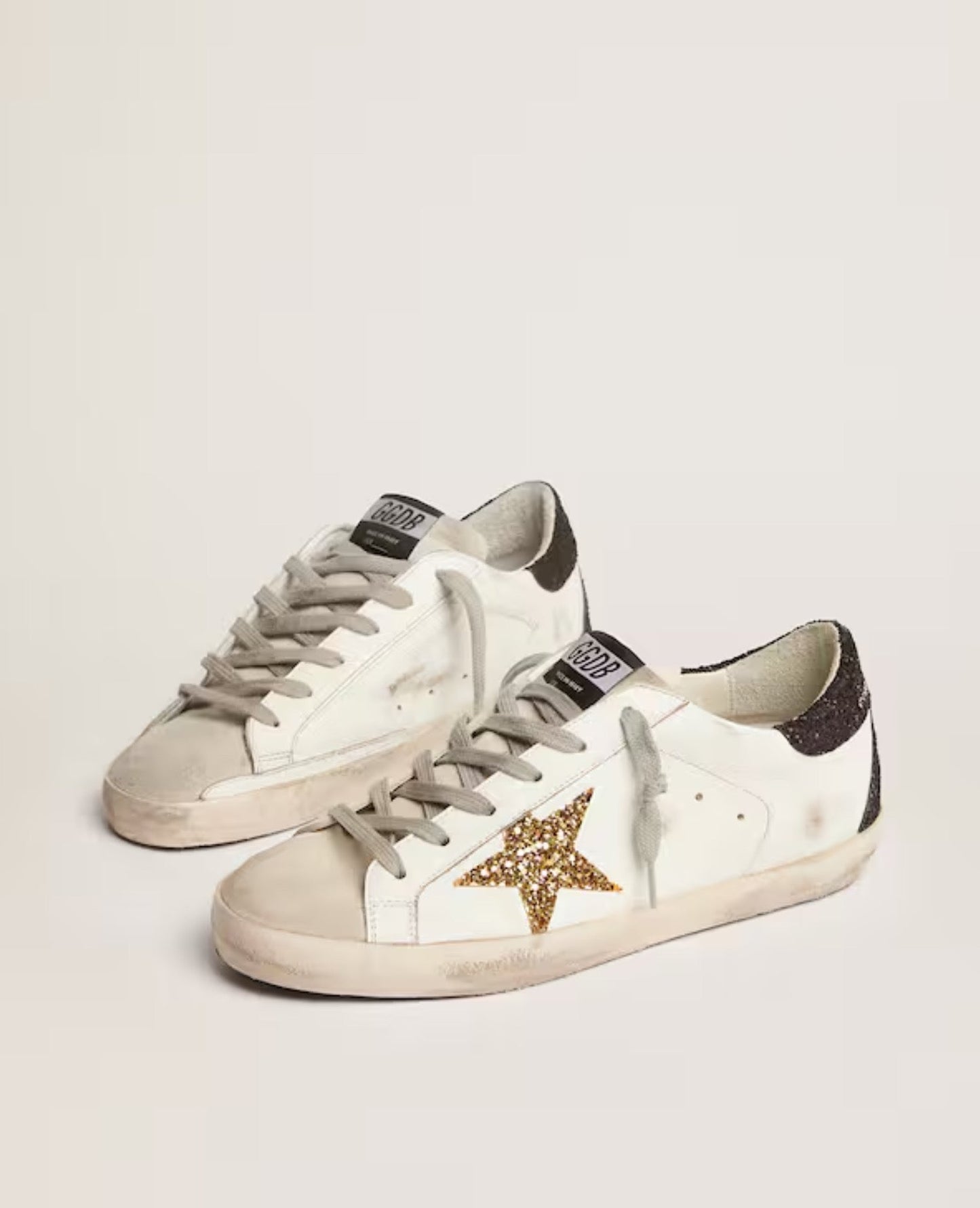 golden goose
women's super-star with gold star and black glitter heel tab_1