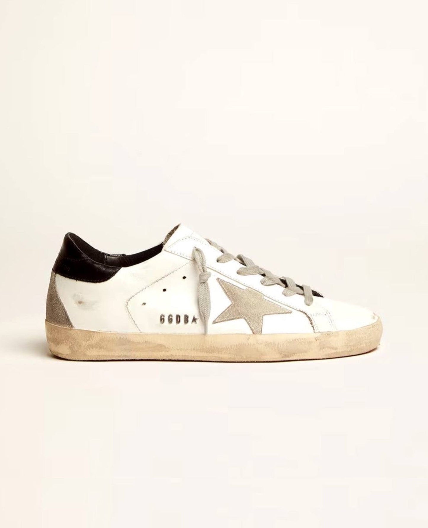 golden goose
super-star with black heel tab and metal stud lettering_1